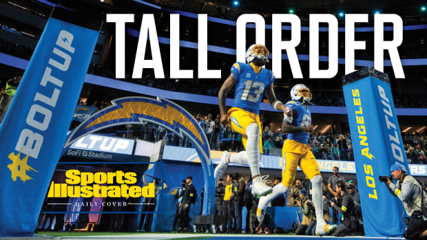 A photo of Chargers players taking the field with the heading TALL ORDER
